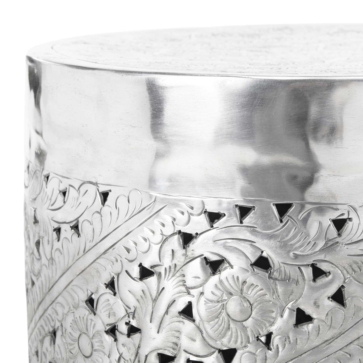 A smooth silver rim frames the round top above ornate floral cutouts.