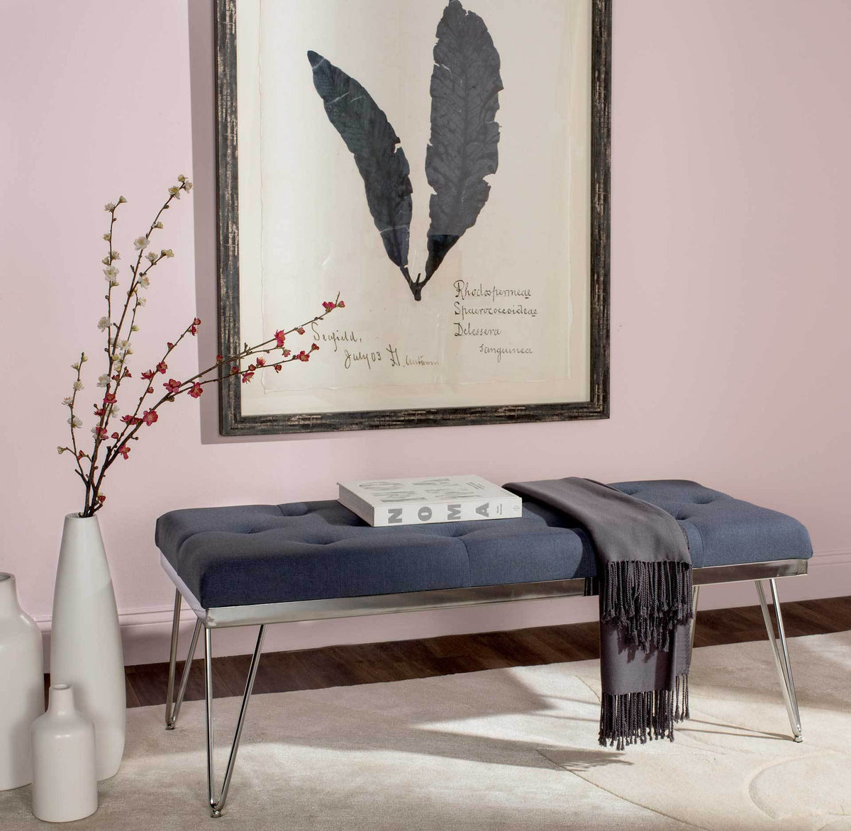 Navy upholstered bench blends a roomy cushioned seat with a light, airy chrome frame.