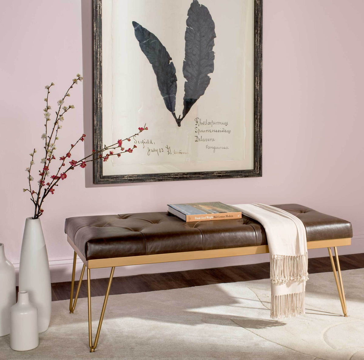 Plush brown faux leather bench offers stylish extra seating on slender gold hairpin legs.