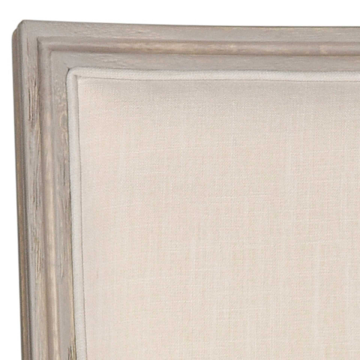 Textured beige linen sits within the layered molding of a rustic gray wood frame.
