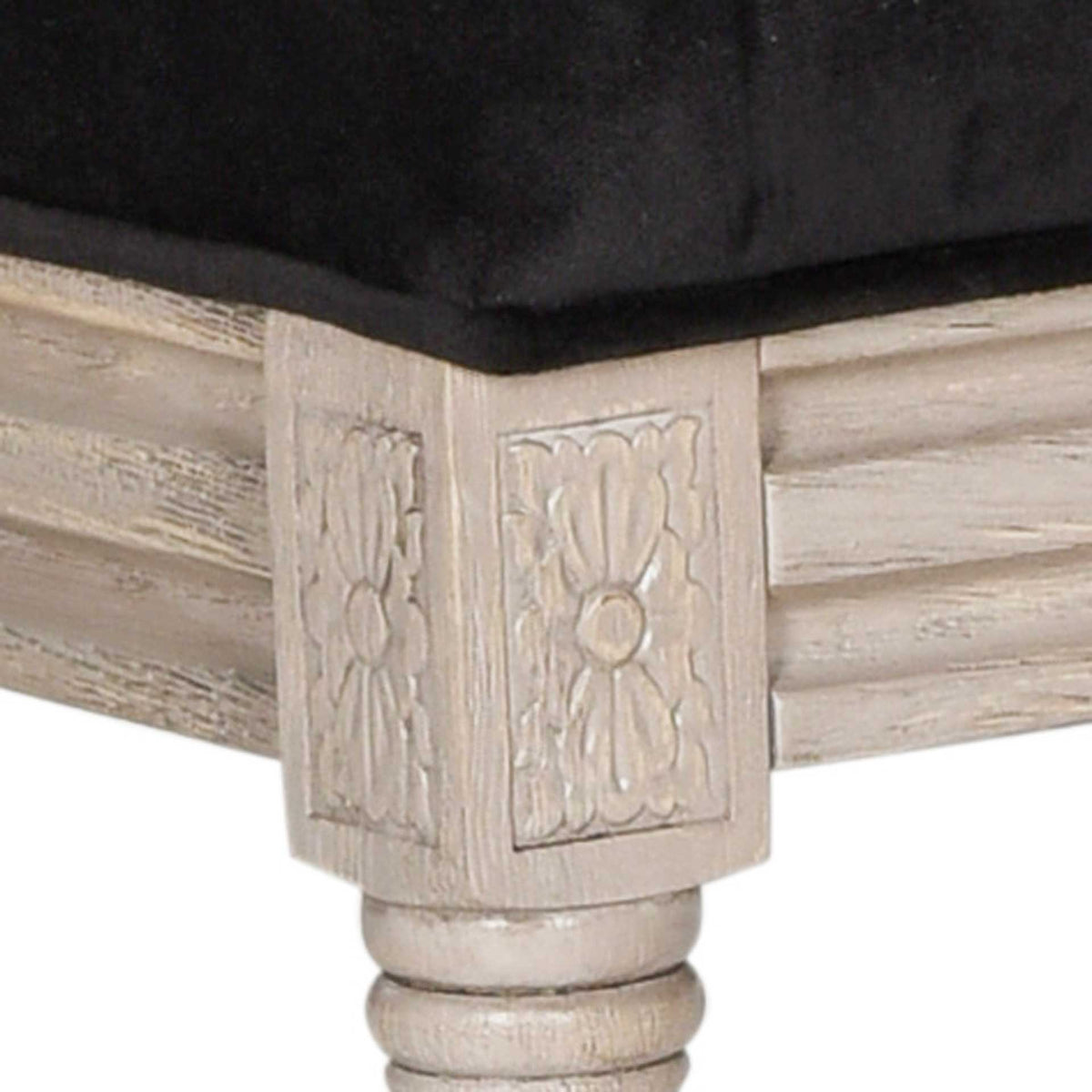 A carved floral corner block sets off plush black velvet and the rustic gray wood finish.