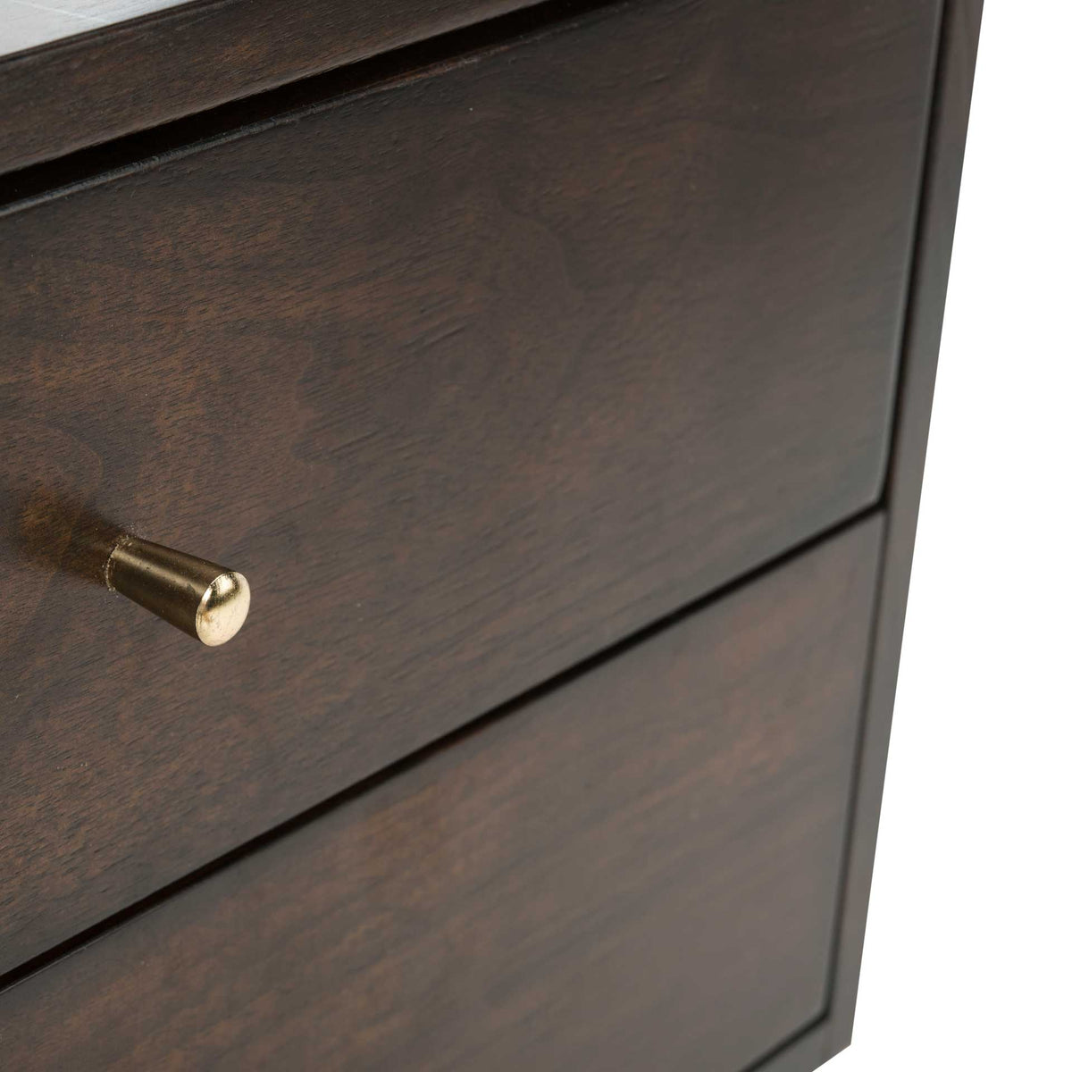 A cylindrical gold drawer pull shines against the dark wood-grain finish