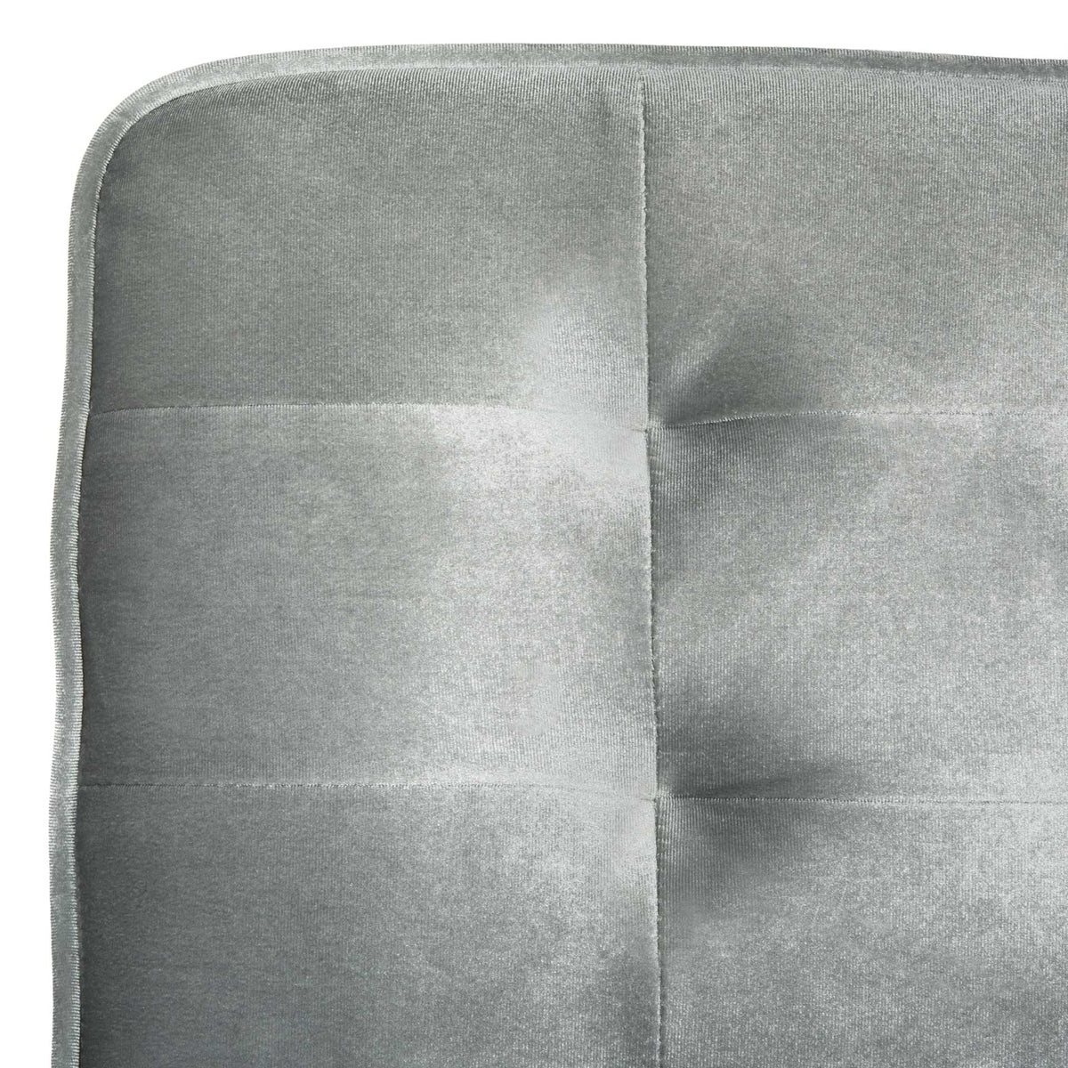 Soft light gray upholstery features subtle tufting and neatly finished piping