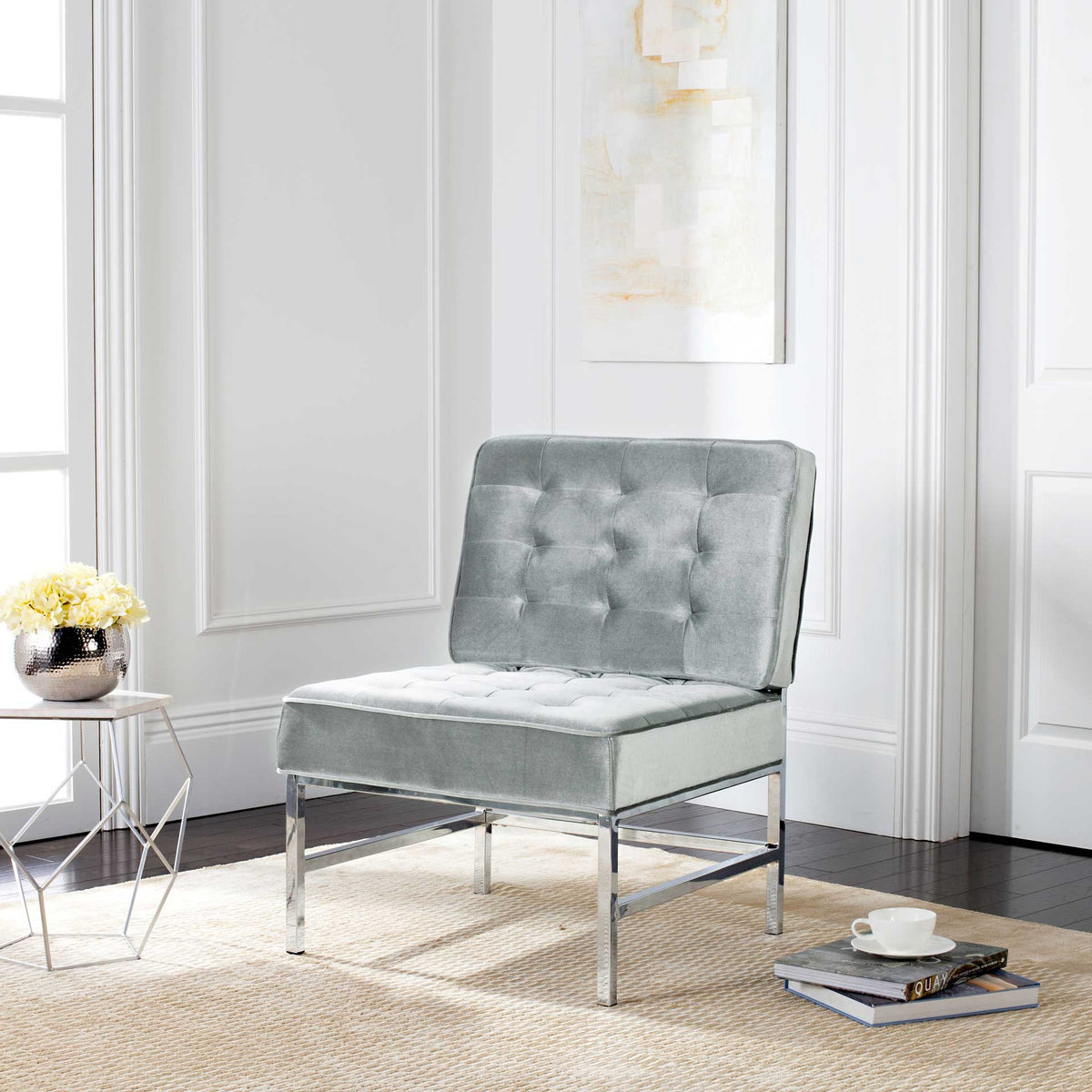 An inviting armless seat pairs soft tufted upholstery with a polished chrome base