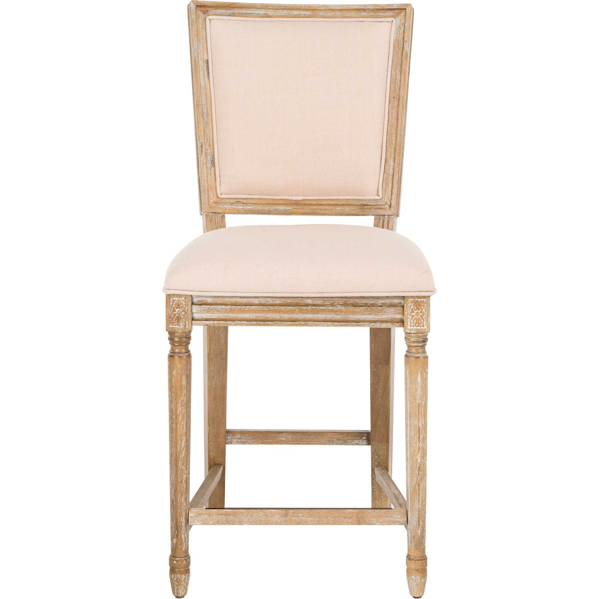 Beige linen cushions the seat and tall rectangular back of this carved oak counter stool. || FOX6271B-SET2 || front_studio