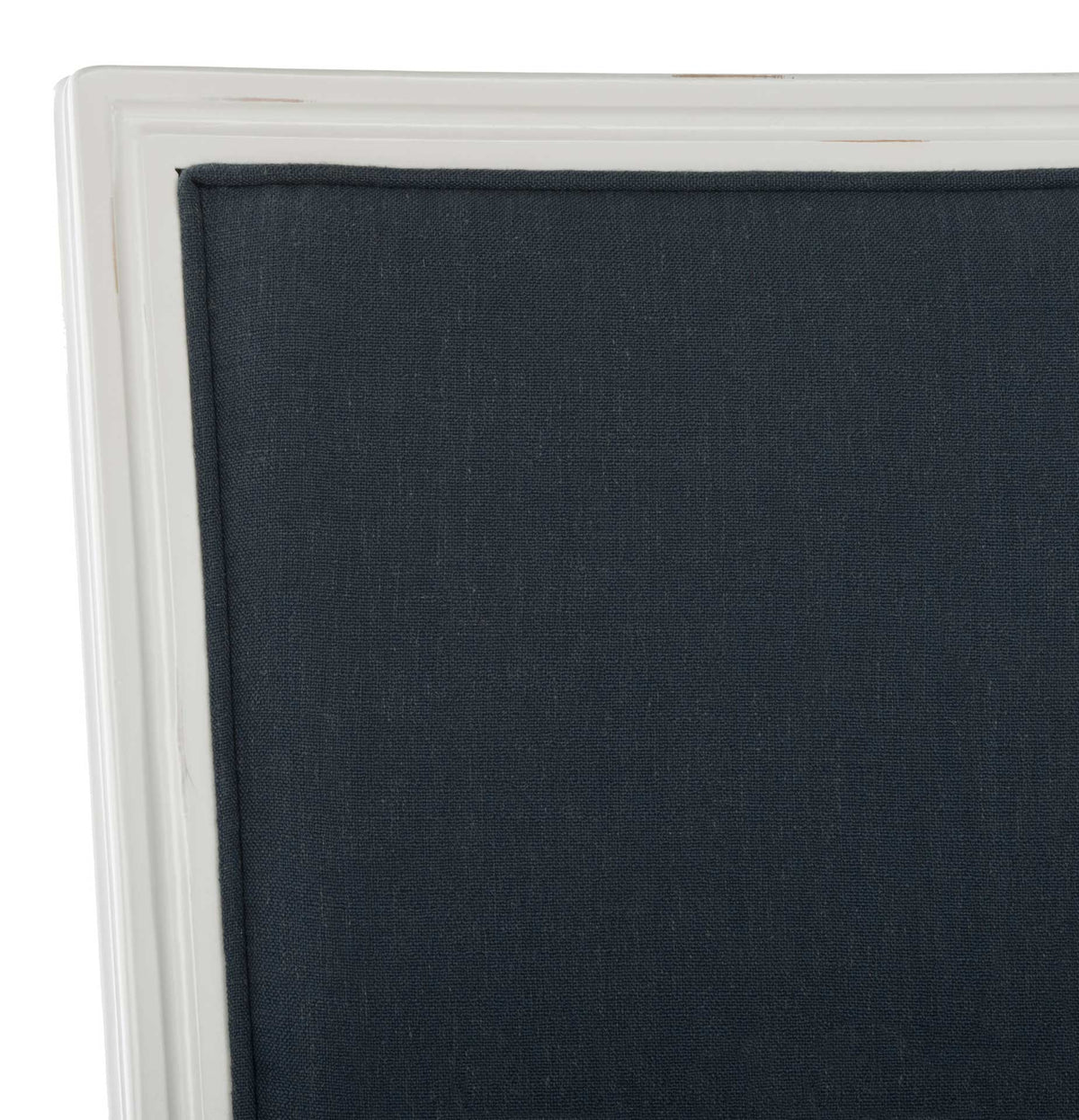 Deep navy linen rests inside a distressed white frame with subtle carved molding.
