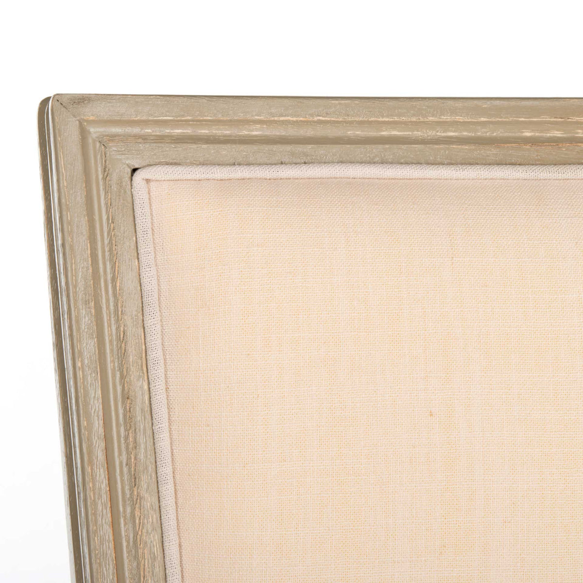 Woven beige linen and softly distressed gray wood lend the backrest subtle texture.