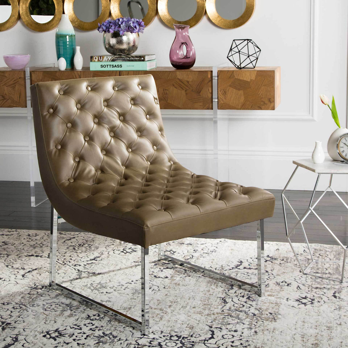 Tufted taupe chair brings warm leather-look texture and chrome accents to a living space