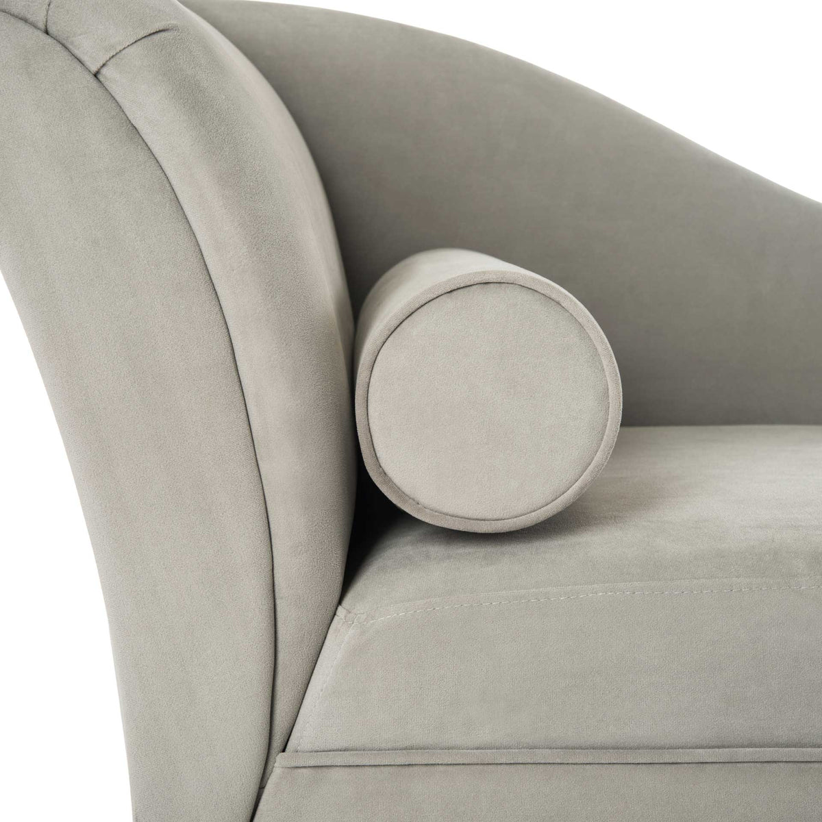 Matching gray velvet bolster nestles against the padded rolled backrest and smooth seat