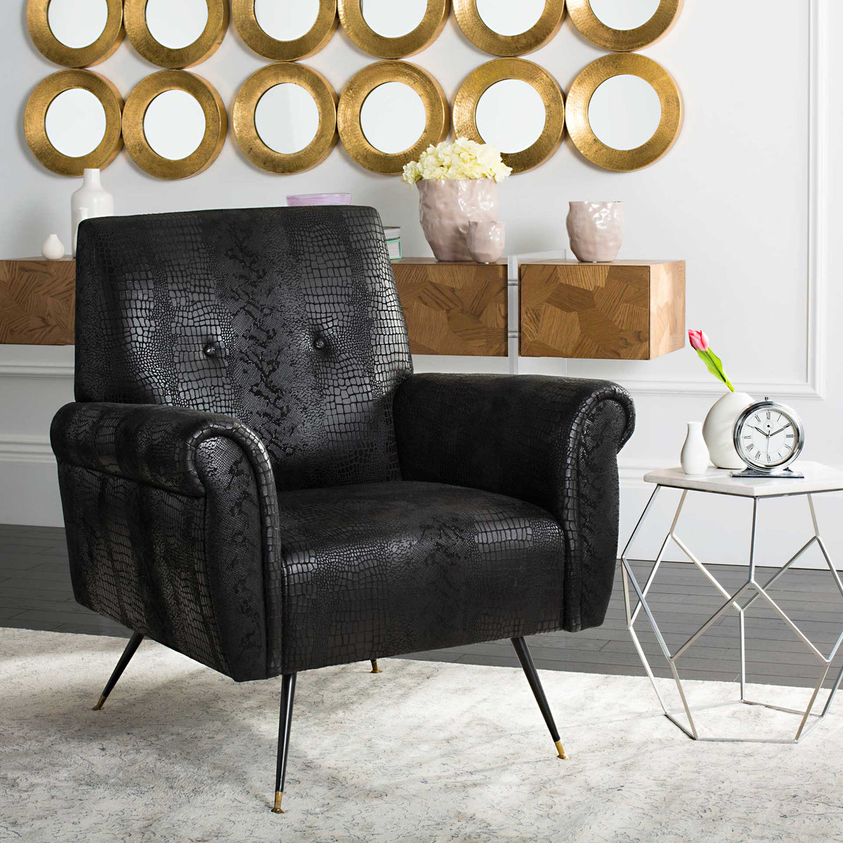 Rolled arms and embossed black upholstery give this cushioned chair retro appeal
