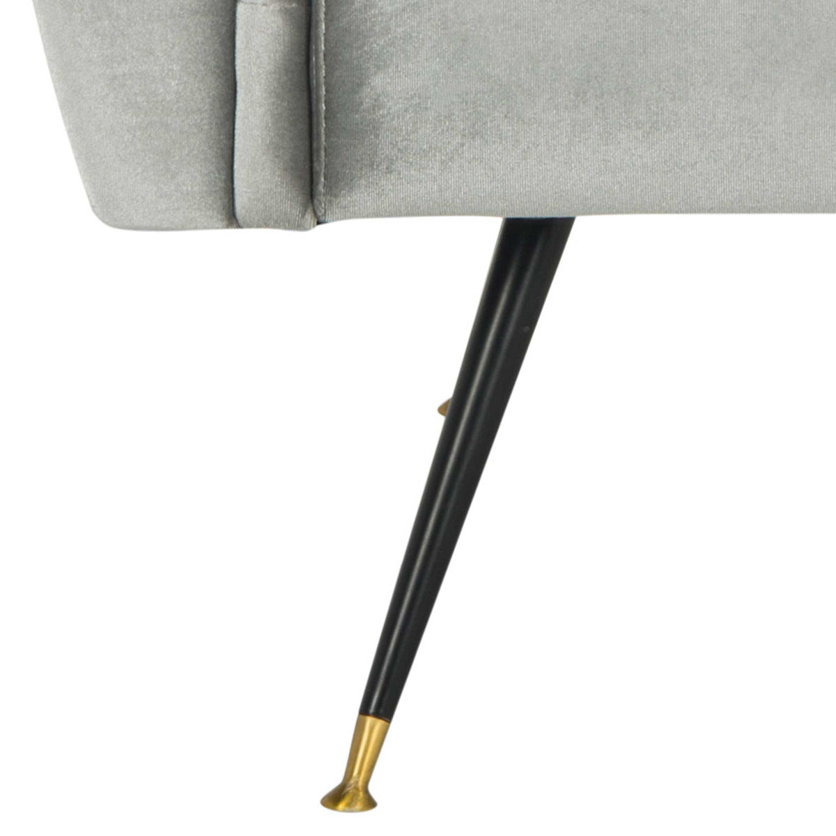 A tapered black metal leg ends in a gold-tone cap beneath the velvet seat
