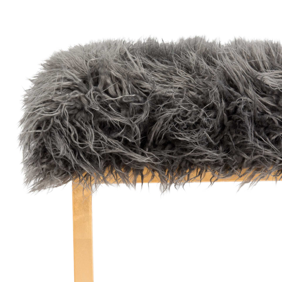 Long gray faux sheepskin fibers drape over a slender gold metal support.