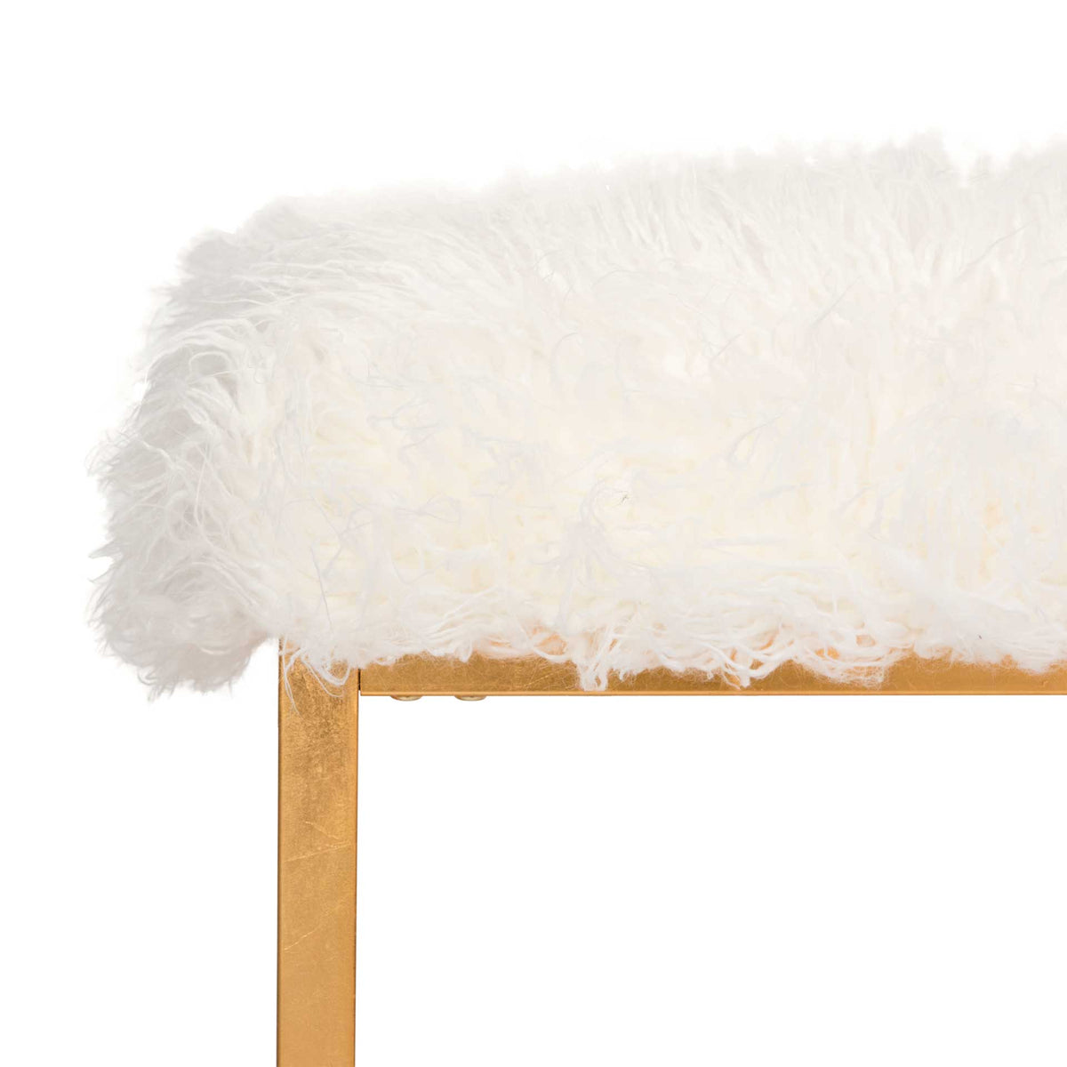 Soft white faux sheepskin spills over the edge of the slim gold metal frame.