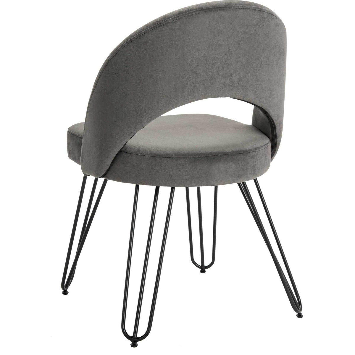 A sculpted gray velvet back sweeps around a soft seat supported by black hairpin legs