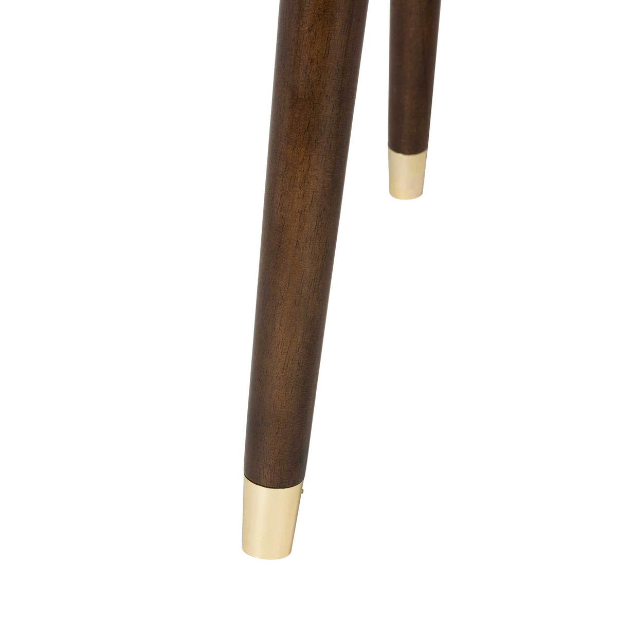 Tapered brown wood legs end in bright gold caps for a polished contrast.