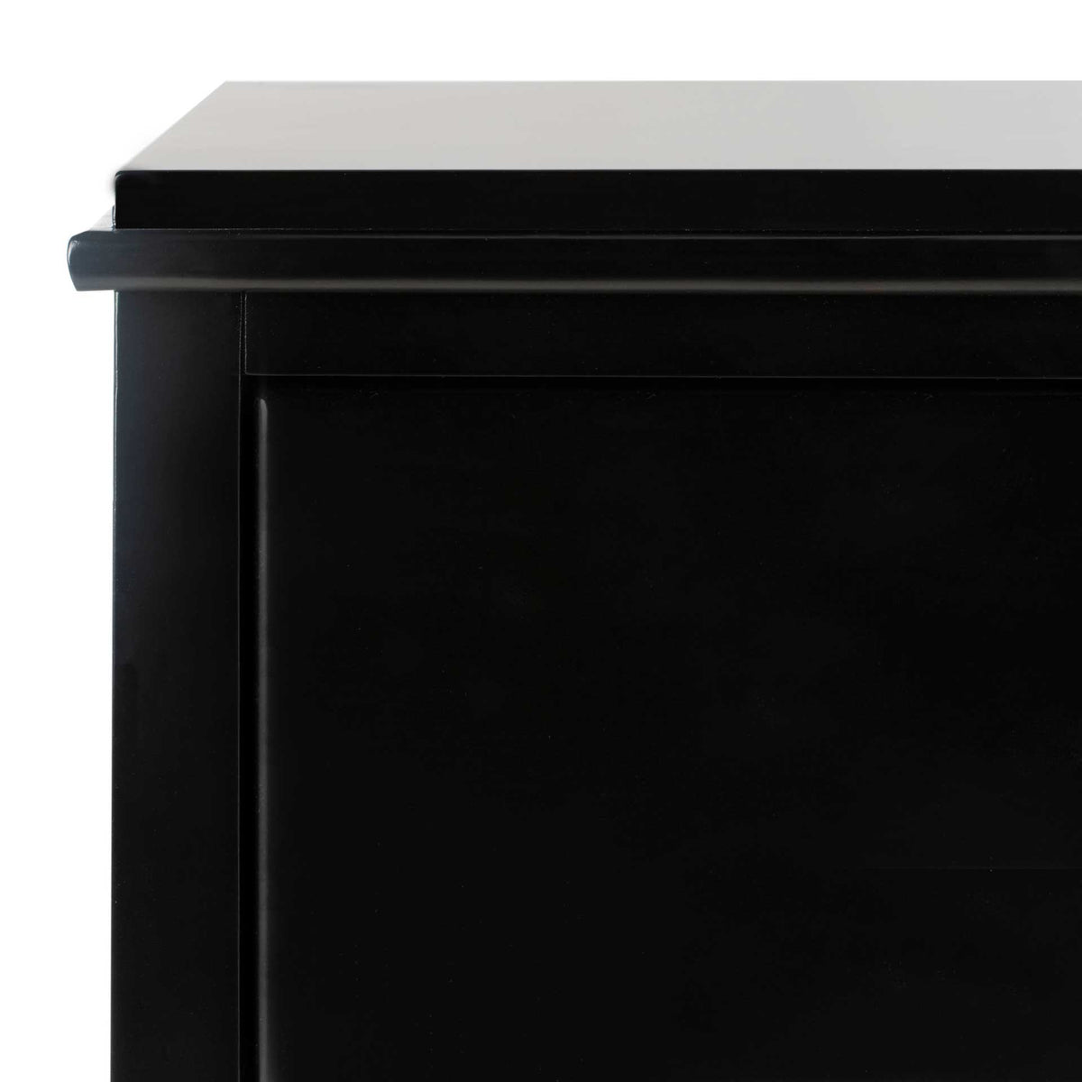 Layered tabletop trim adds a subtle architectural edge to the smooth black finish