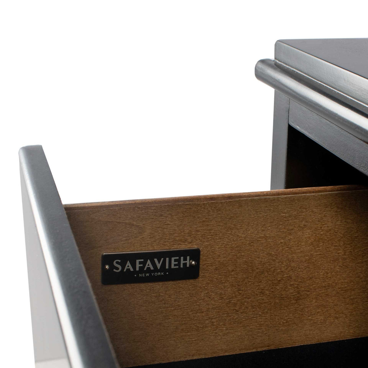 Warm wood drawer sides bring natural contrast to the sleek black nightstand