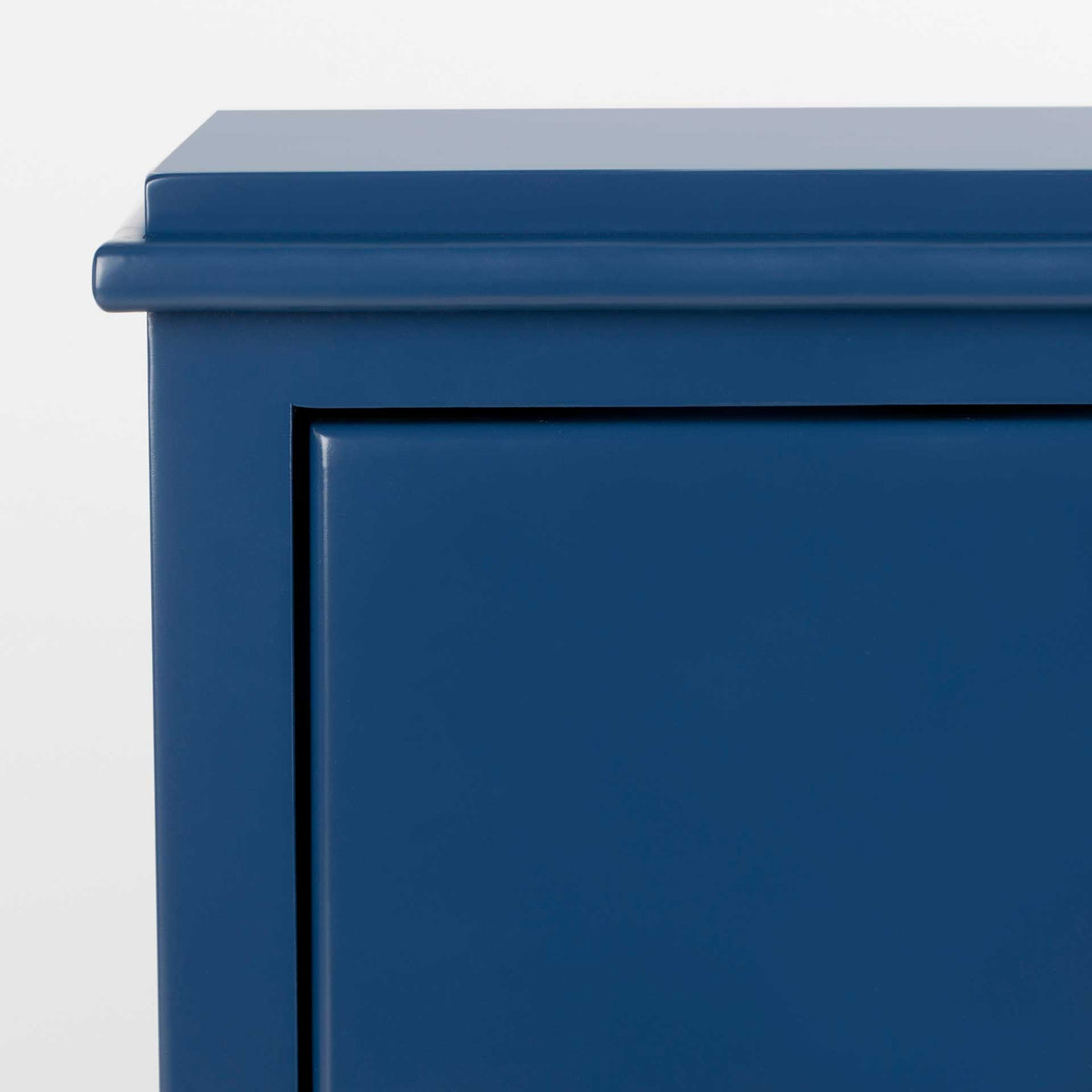 Layered molding gives the navy tabletop a crisp, polished edge