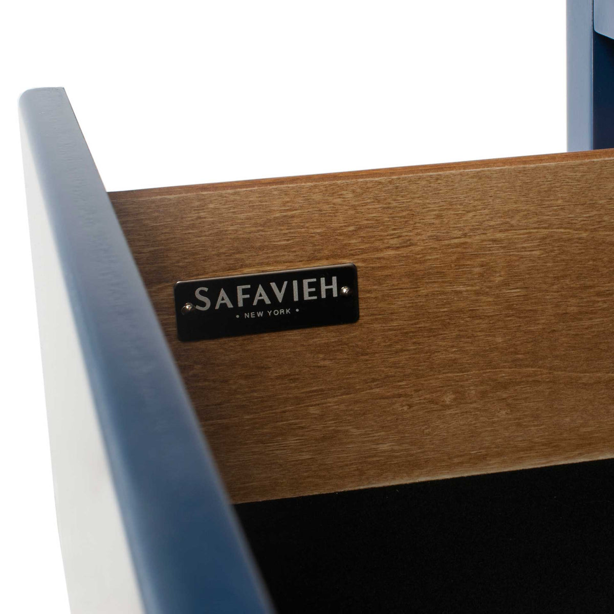Natural wood drawer sides create warm contrast against the navy exterior