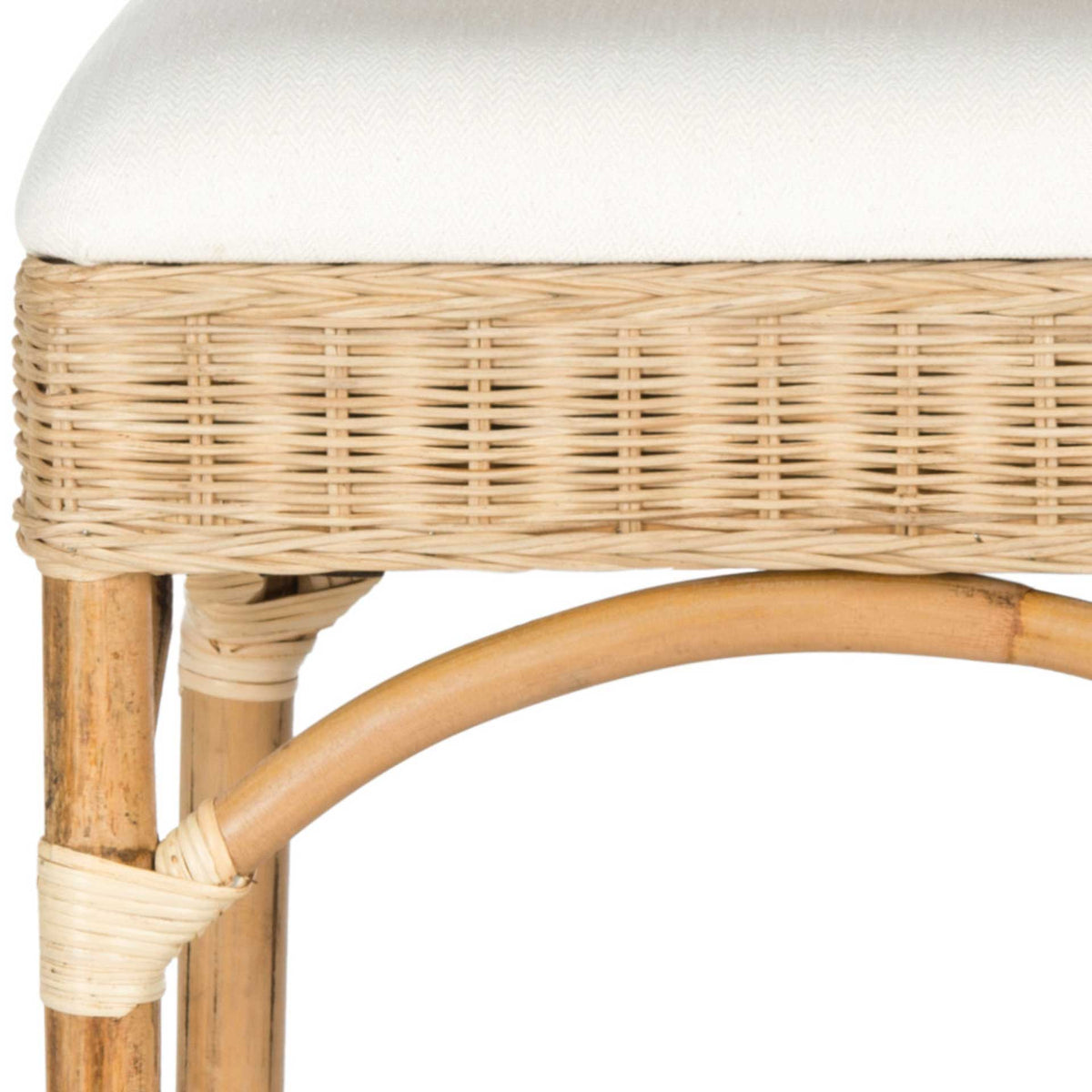 A white seat cushion tops tightly woven natural rattan, with pale wraps accenting a gently curved support.