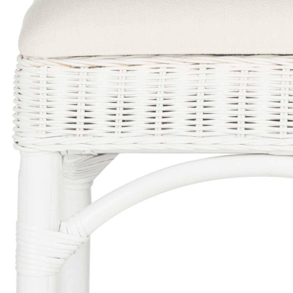 White rattan weaving surrounds the cushion, with wrap accents and a curved brace reinforcing the airy frame.