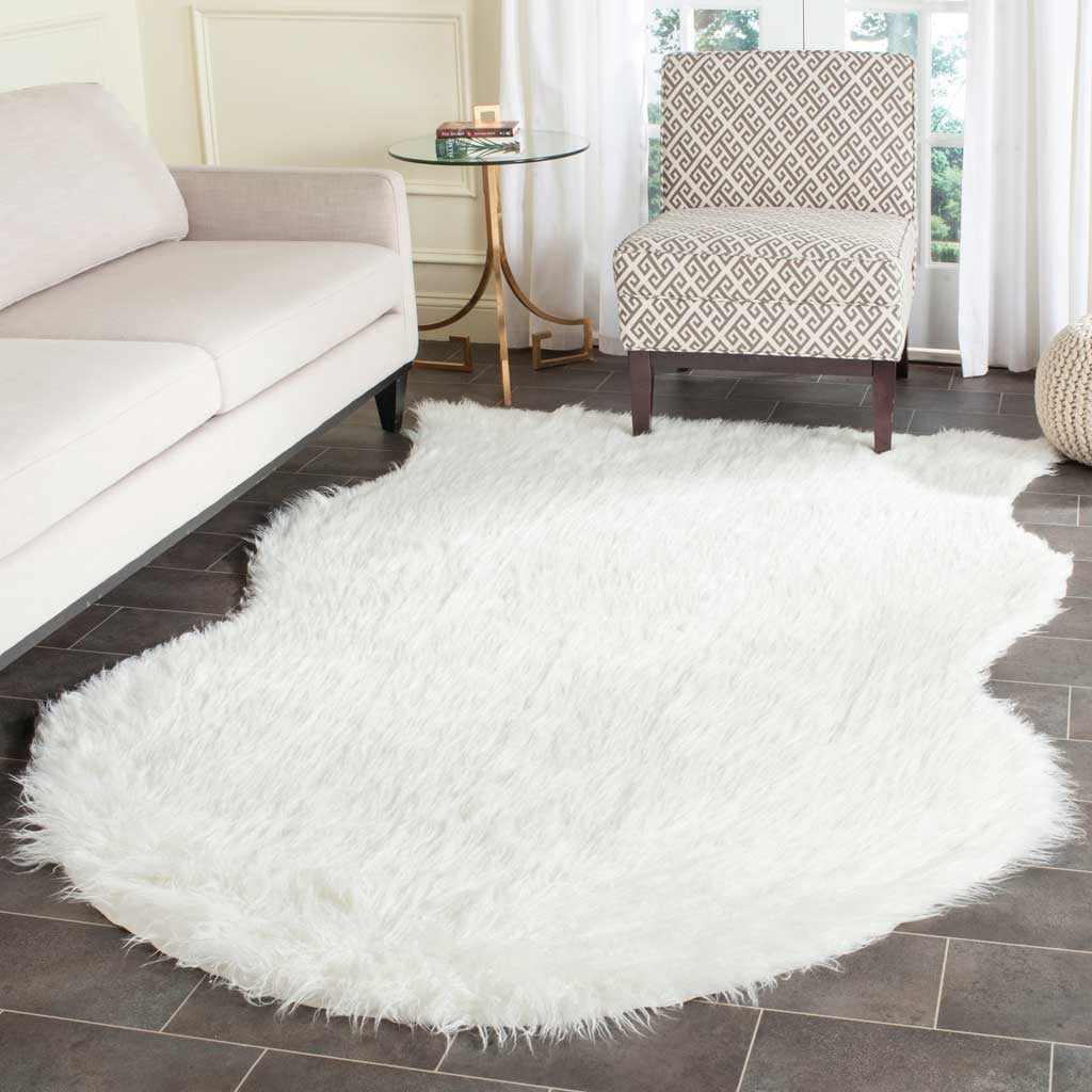 Ivory shag rug softens a tiled seating area with its organic outline and cozy texture