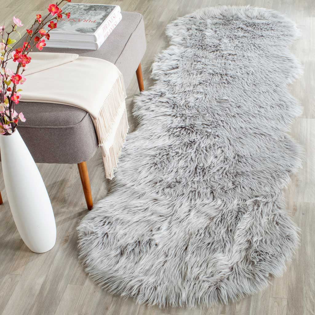 A light gray shag runner lends soft, mottled texture to the floor beside a neutral chair.