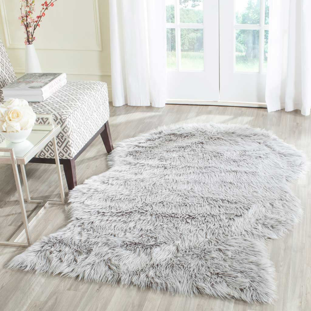Silver-gray shag rug brings a soft, sculpted outline to a bright wood-floored room