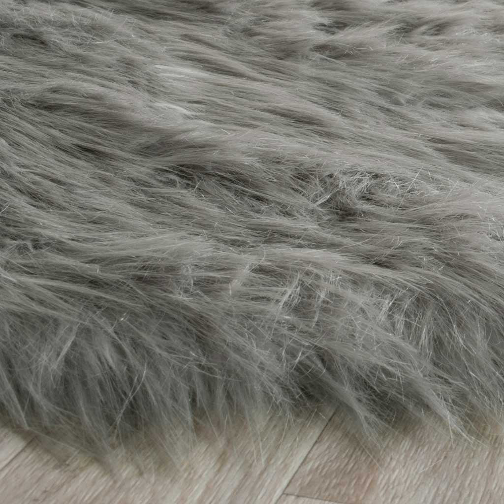 Dense gray faux fur spills over the runner's edge, emphasizing its soft, lofty texture.