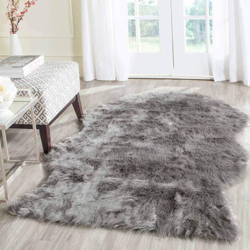 Shaggy dark gray hide-shaped rug brings soft texture alongside a patterned chair