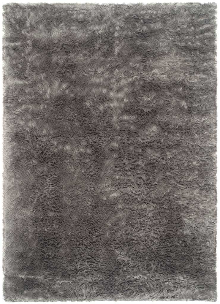 Deep gray shag rug with dense faux-fur texture across its clean rectangular shape