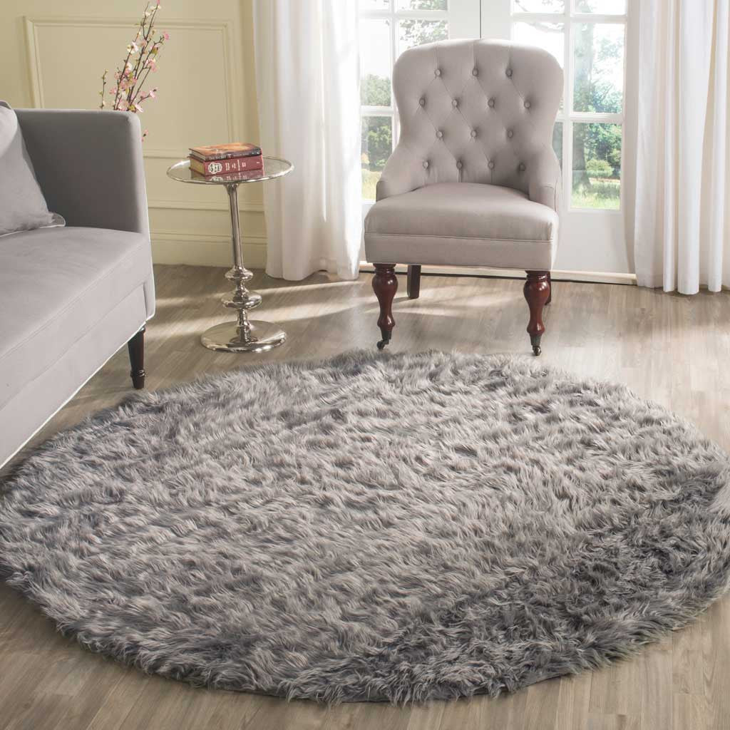 Plush round gray rug anchors a seating area with its deep shag and inviting texture