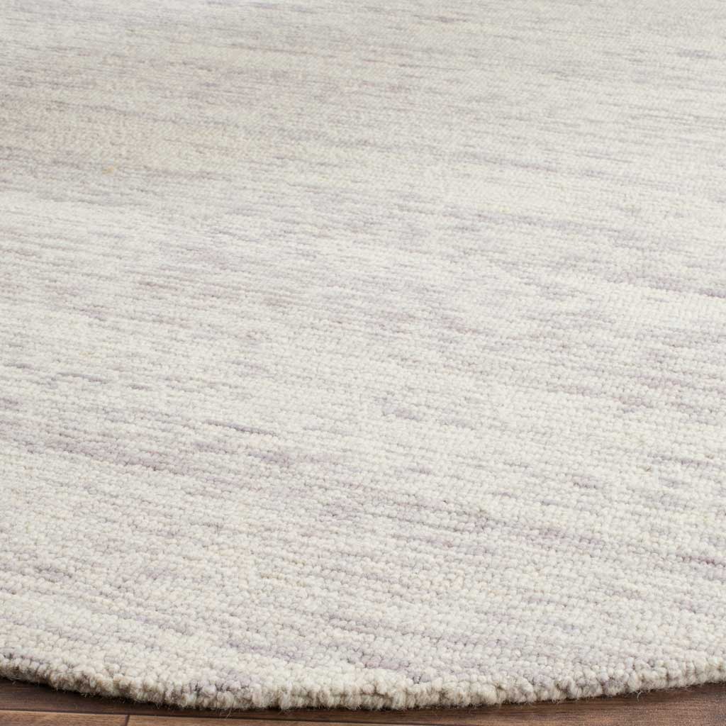 Silver and ivory wool fibers form a softly textured surface with a neat edge