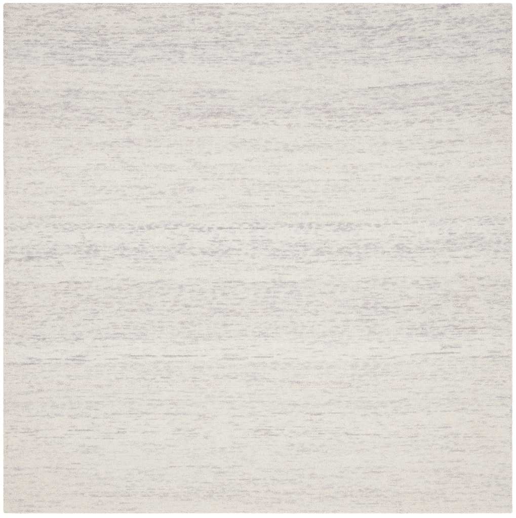 Square silver wool rug with subtle linear mottling across an ivory-toned ground