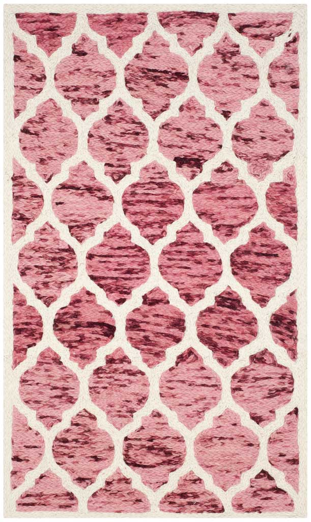 Compact wool rug with warm red quatrefoils against a creamy ivory background