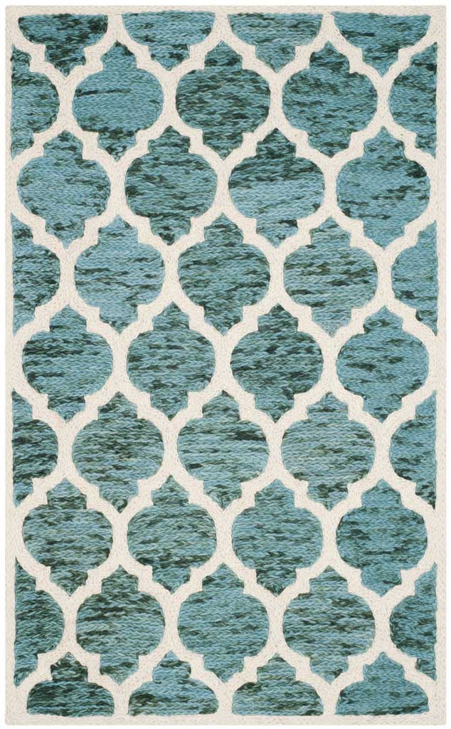 Compact turquoise wool rug with oversized quatrefoils outlined in soft ivory