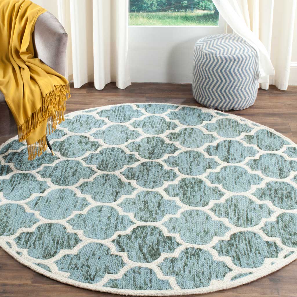 Turquoise and ivory wool rug brings a breezy geometric accent to a living space