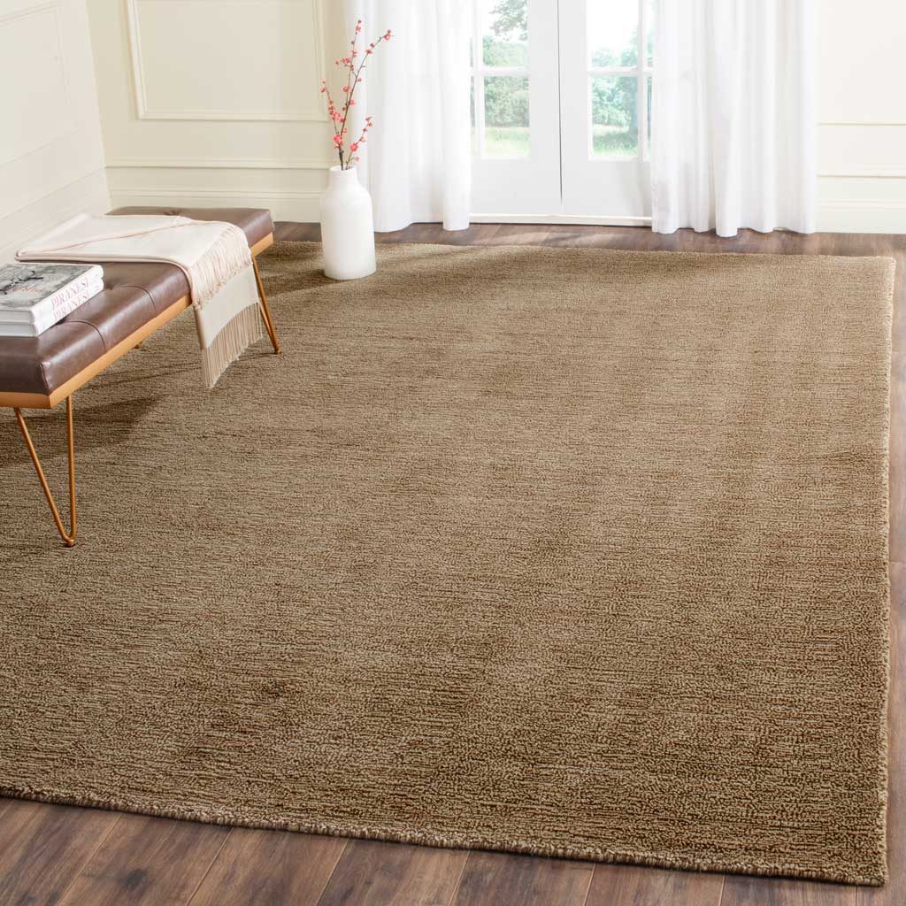 Earthy brown rug adds warm texture beneath an accent bench