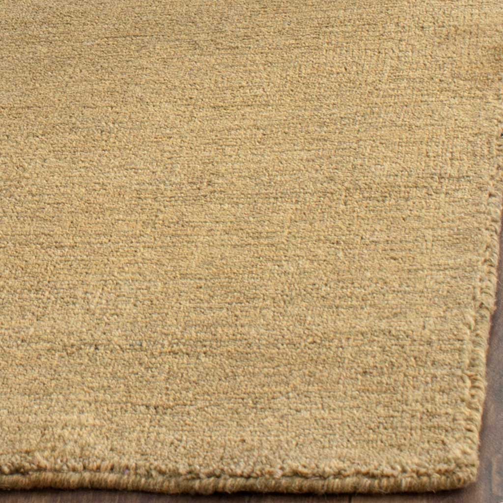 Olive-toned fibers create a soft texture with a neatly finished corner