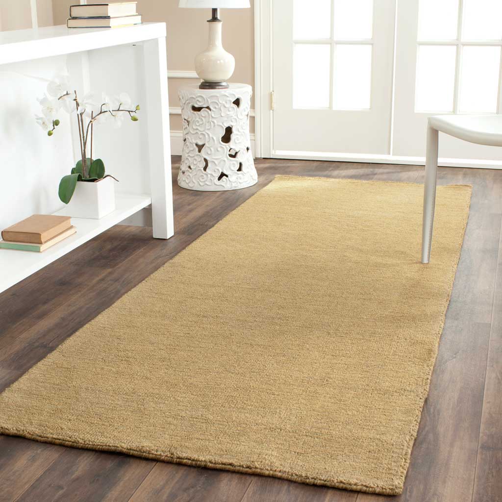 Low-profile olive green runner brings gentle tonal depth to narrow spaces