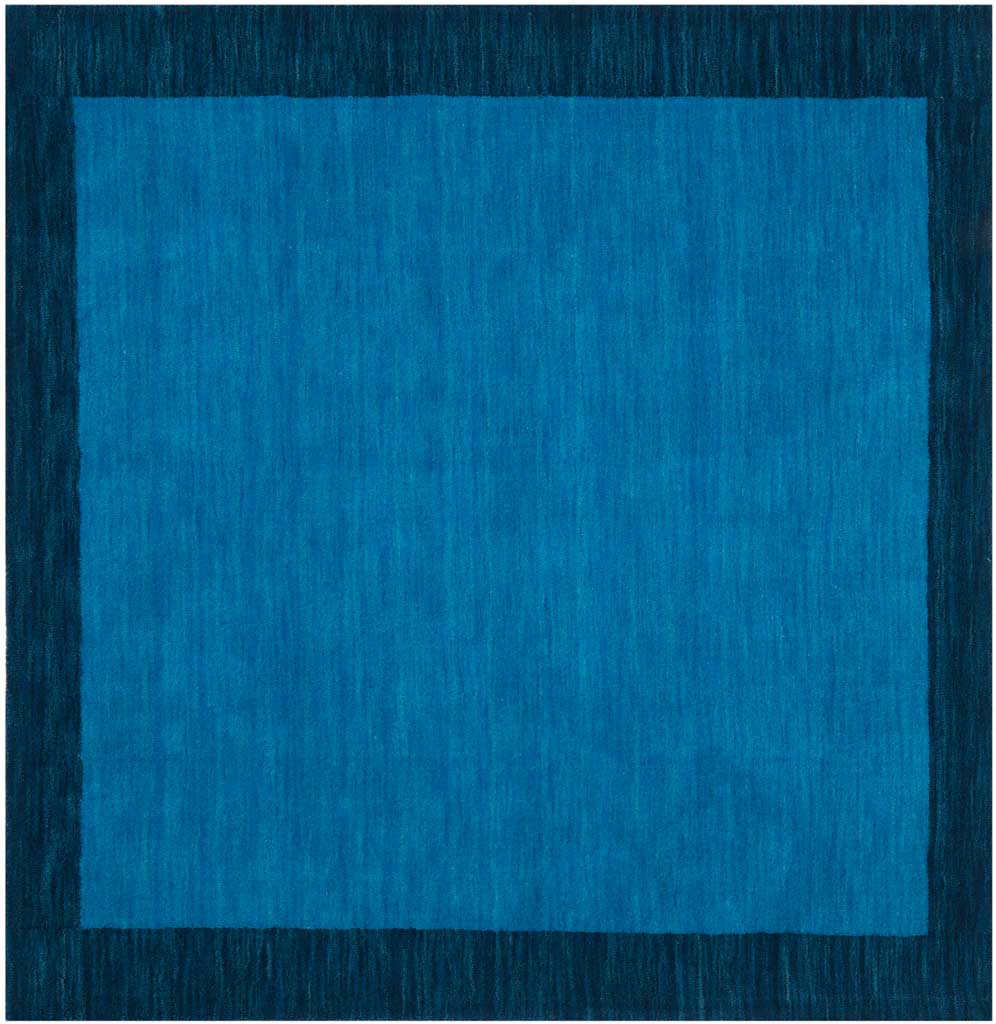 Light and dark blue hues give this square wool rug a crisp framed look