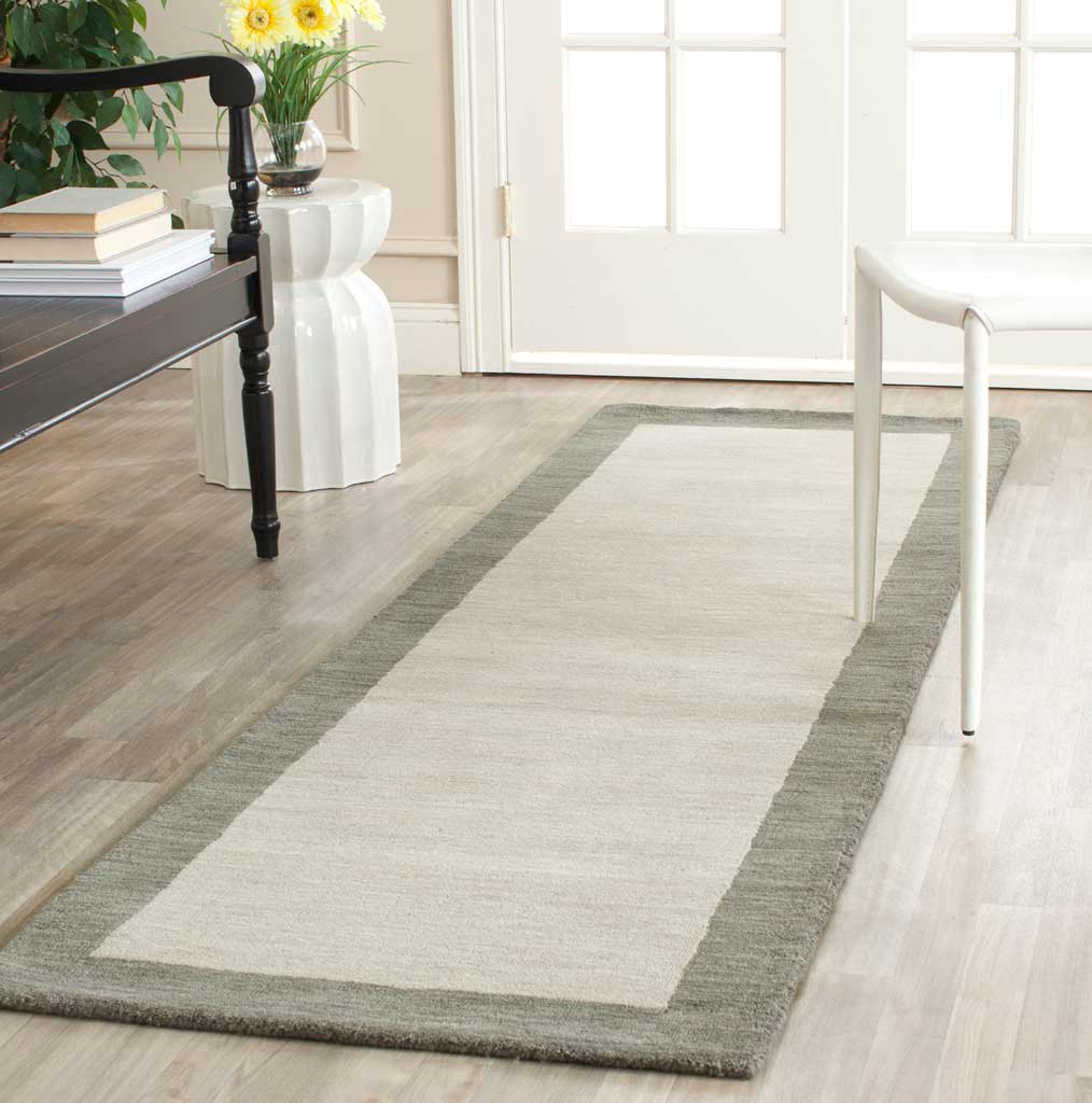 Two-tone gray runner lends understated contrast and softness to a bright entryway