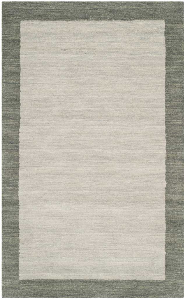 Soft gray wool and a deeper tonal border define this compact rectangular rug