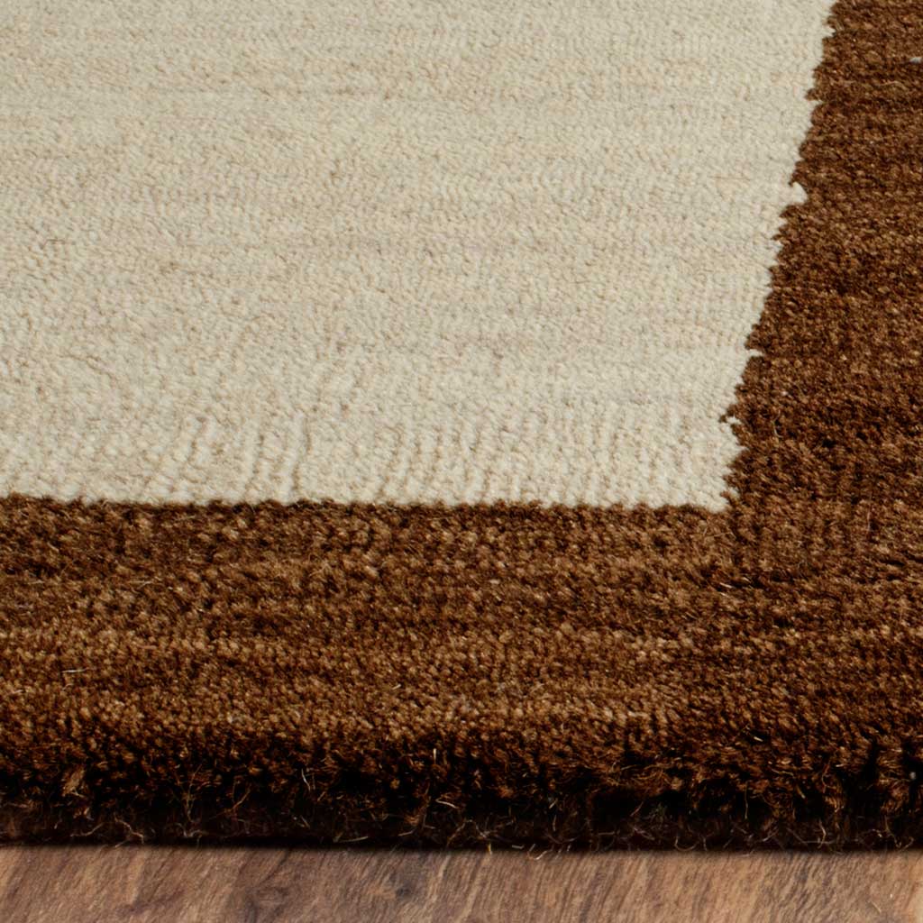 Soft beige wool pile meets a plush dark brown border