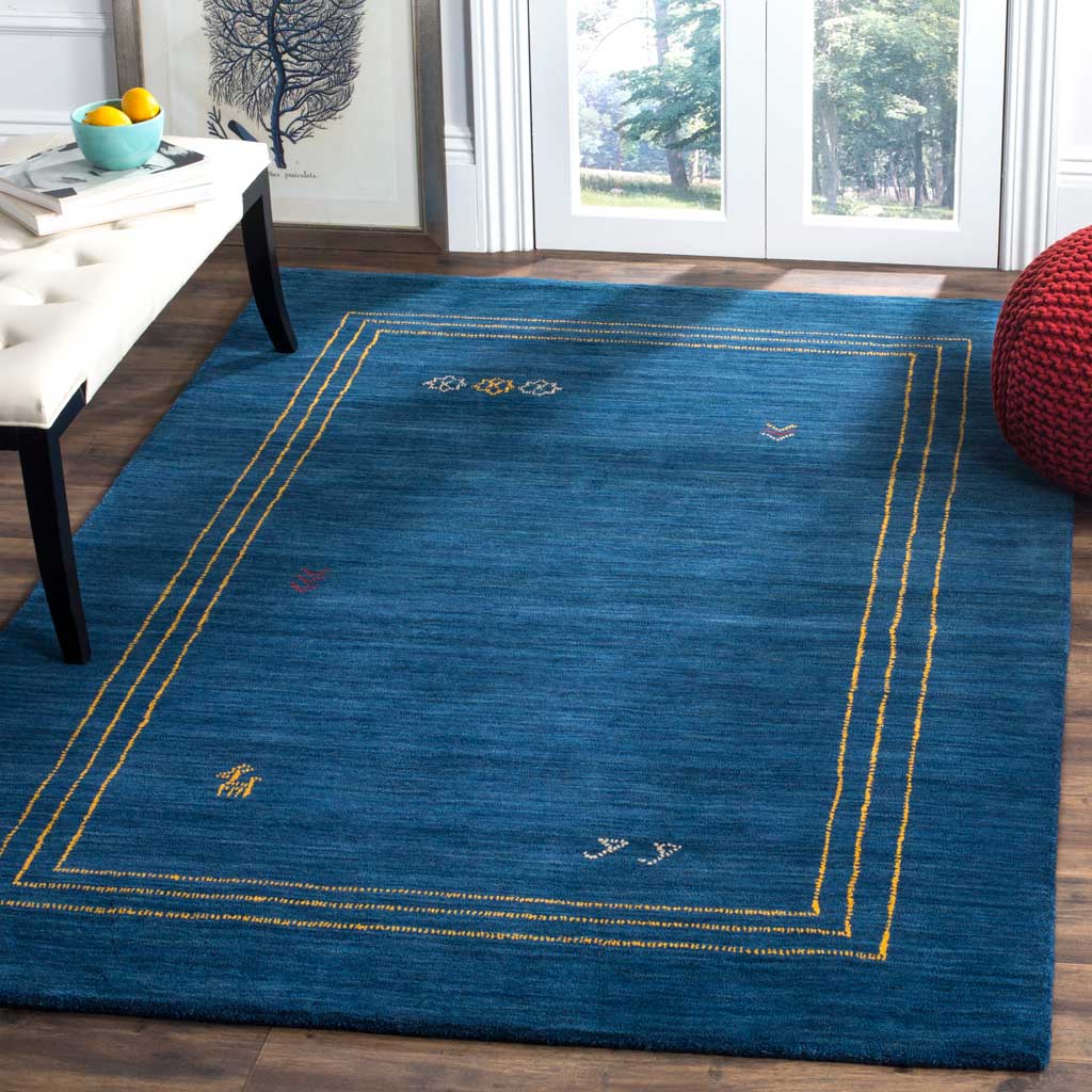 Deep blue wool and delicate gold framing enliven a living space with bright, playful accents