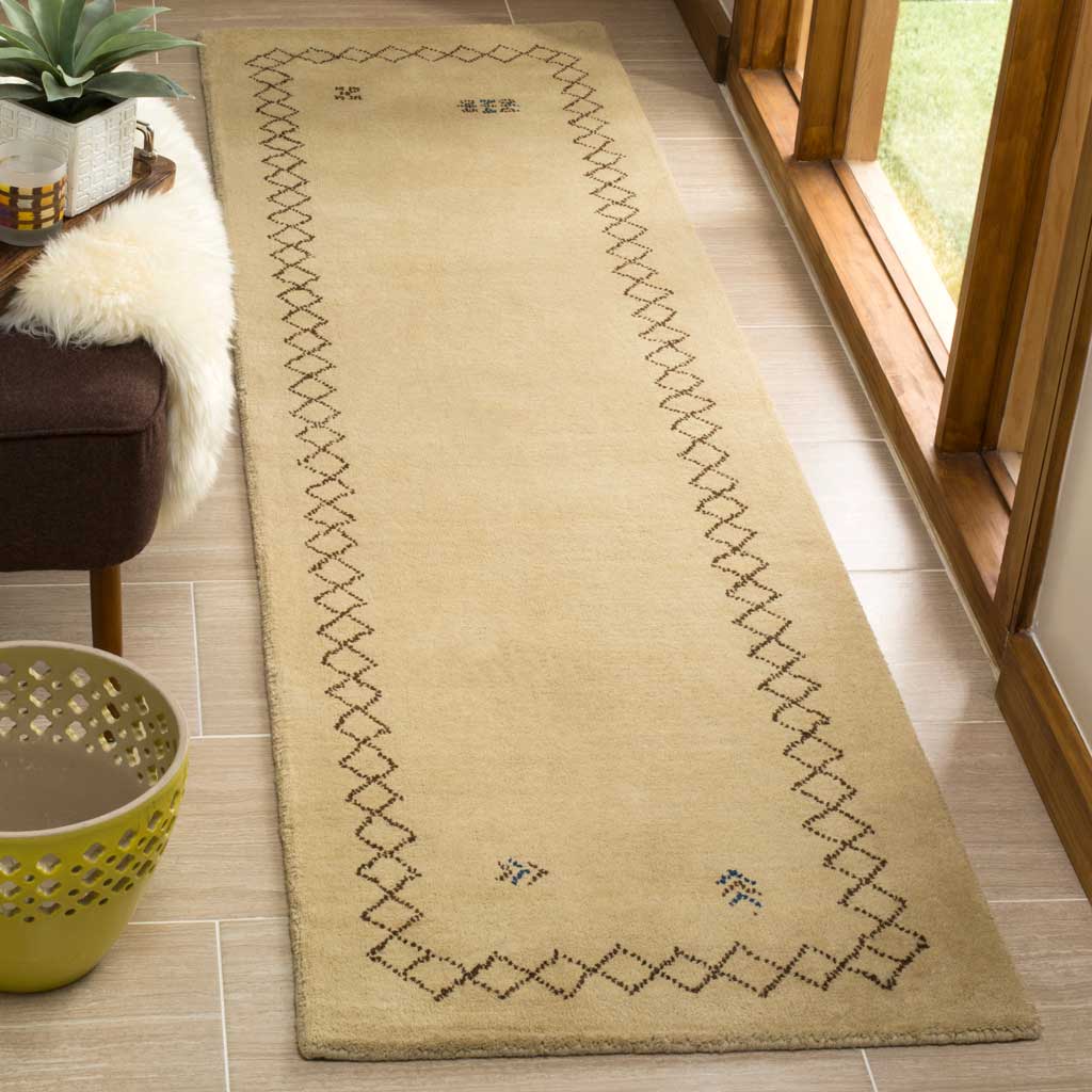 Beige runner with a dark geometric border adds warmth beside glass doors