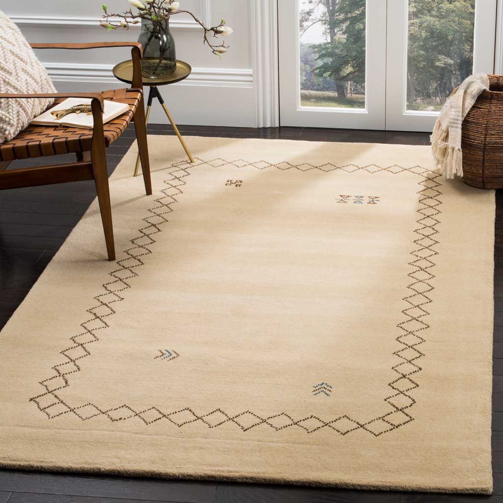 Warm beige wool rug with an airy diamond border and scattered motifs softens a living space