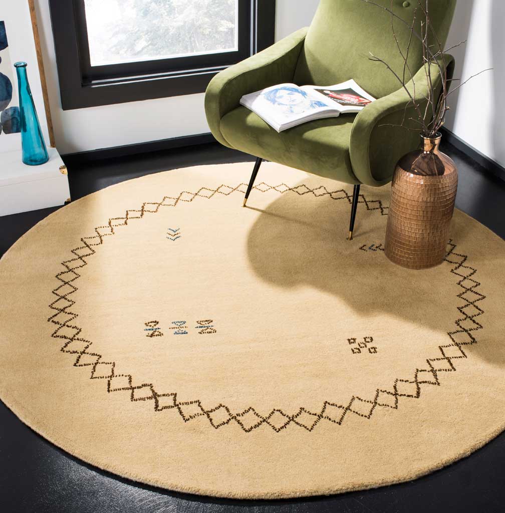Warm beige round rug anchors a living space with its graphic diamond border