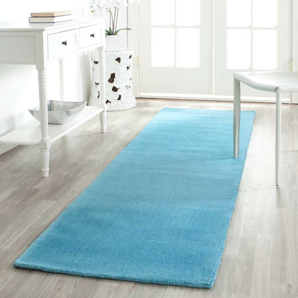 Turquoise runner refreshes a bright hallway with gentle color and soft texture.