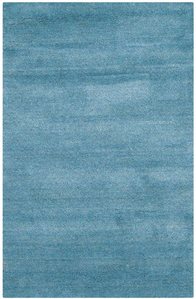Compact blue accent rug with subtle horizontal shading and a plush, even pile